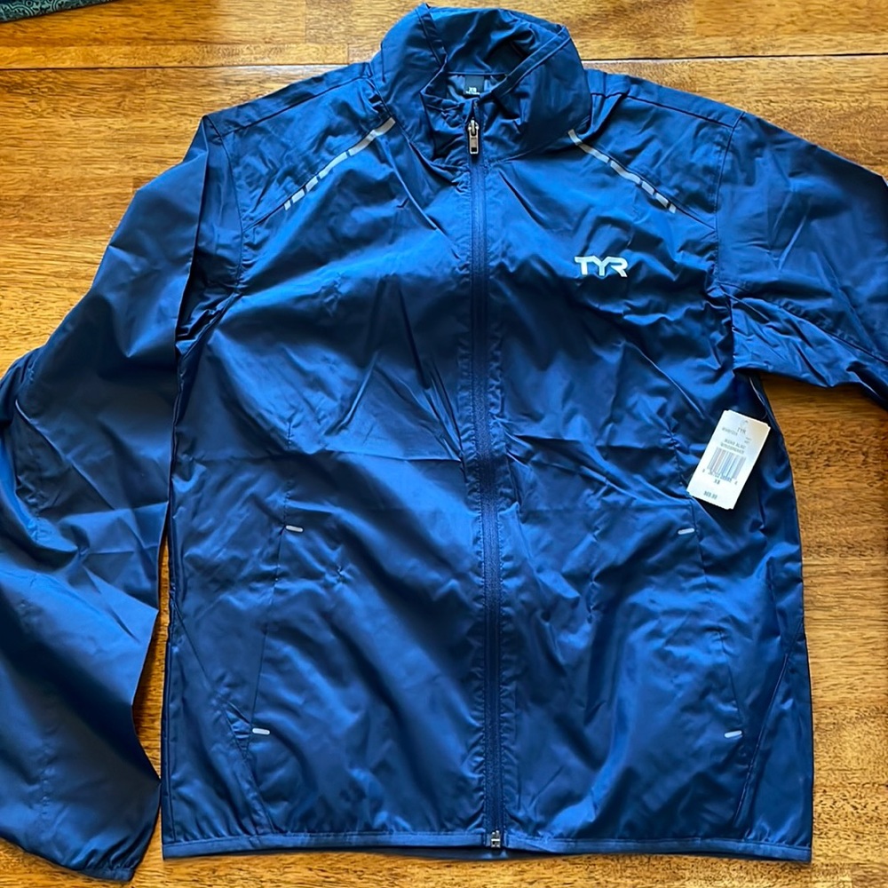 TYR NWT navy blue windbreaker. Size XS. Two front pockets. Smoke free home